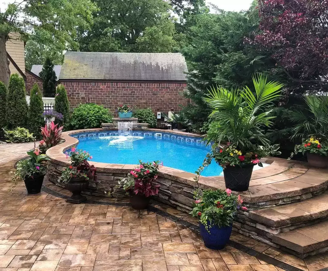 A Pool With Lush Surroundings