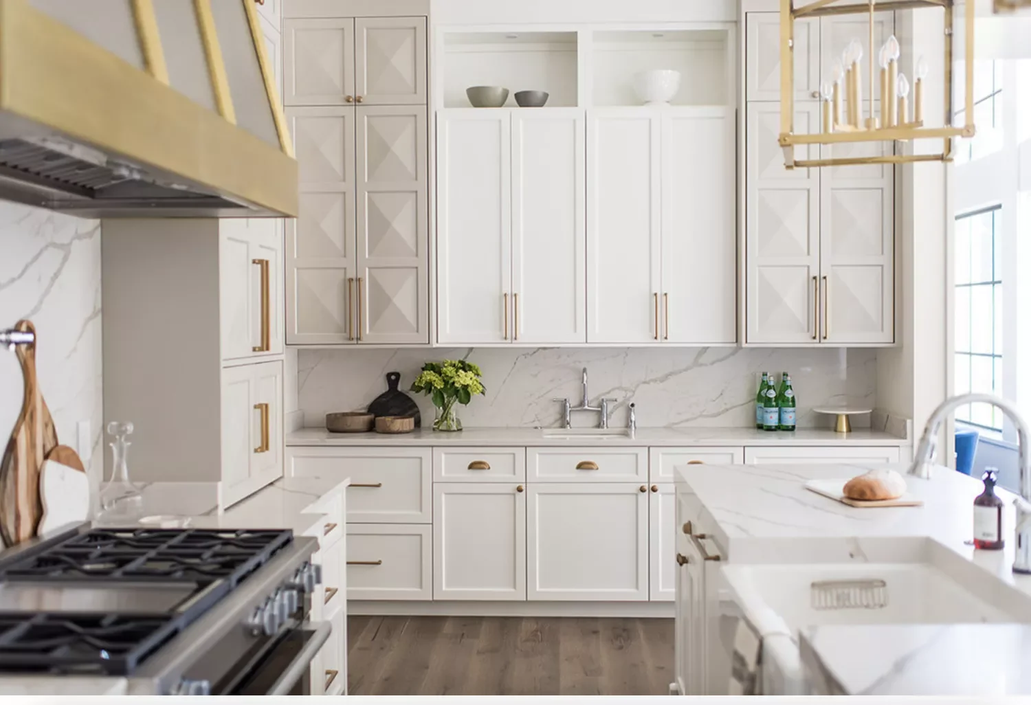 White and Gold Kitchen With Wrapped Range Hood